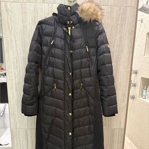 Michael Kors extra long winter puffer with gold accents and faux fur hood